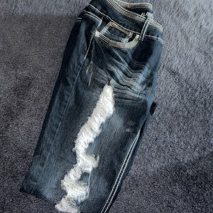 Almost famous low rise skinny jeans with blinged out back pockets